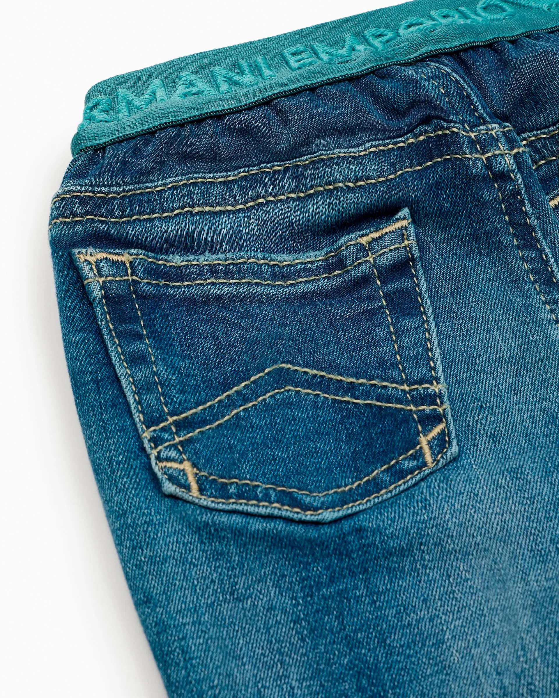 Jeans a lavaggio medio stone washed in cotone stretch con fascia elastica logata ottanio 12-36 mesi