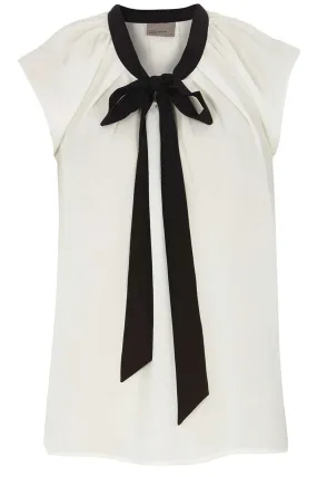 Maglione bianco con giromanica e fiocco nero