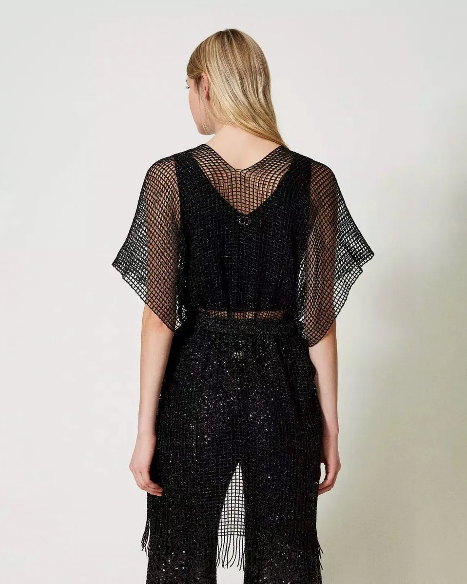Poncho nero in rete viscosa con lurex con cintura in vita e frange al fondo